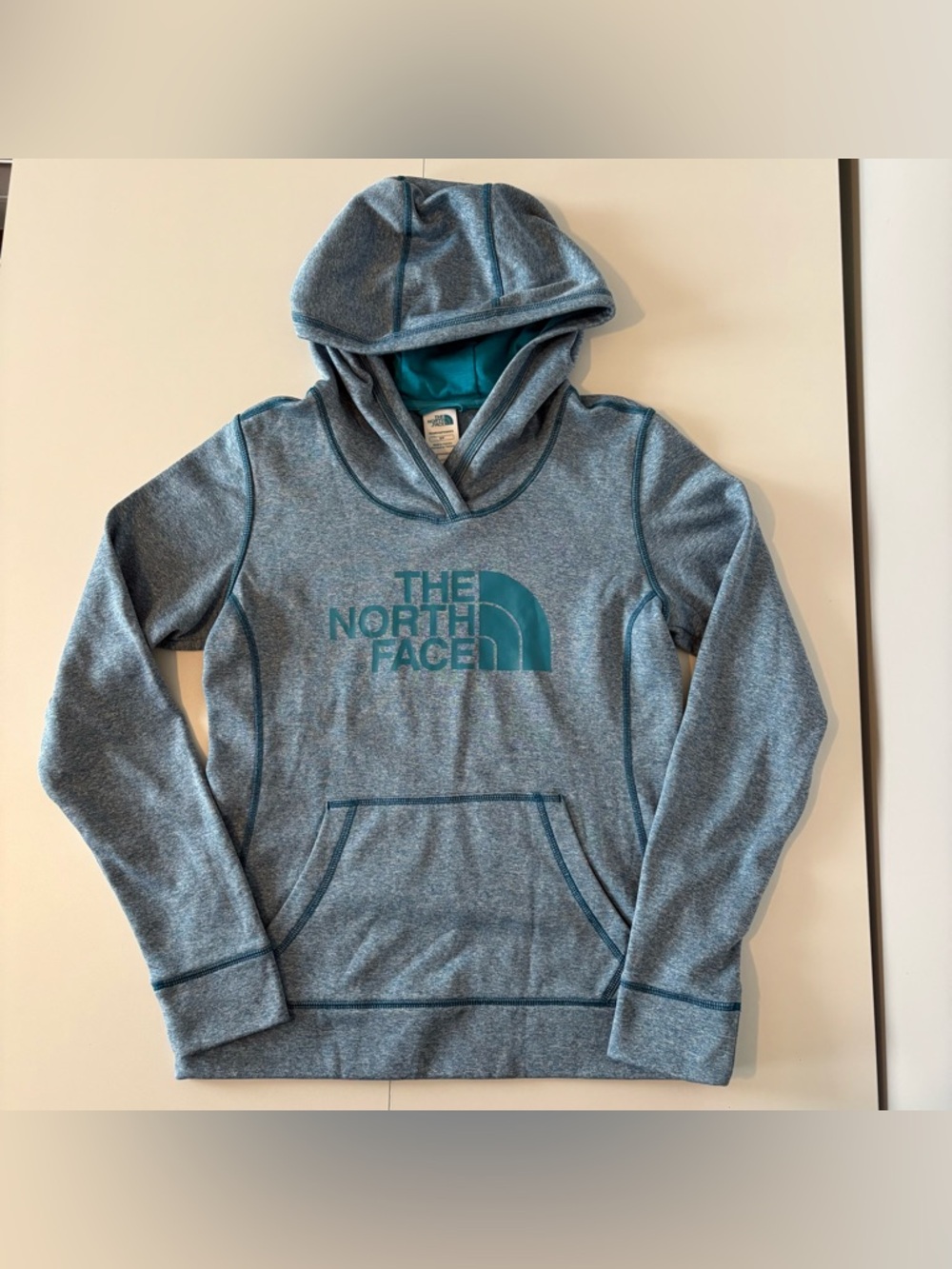 The North Face Heathered Blue Pullover Hoodie with Teal Logo